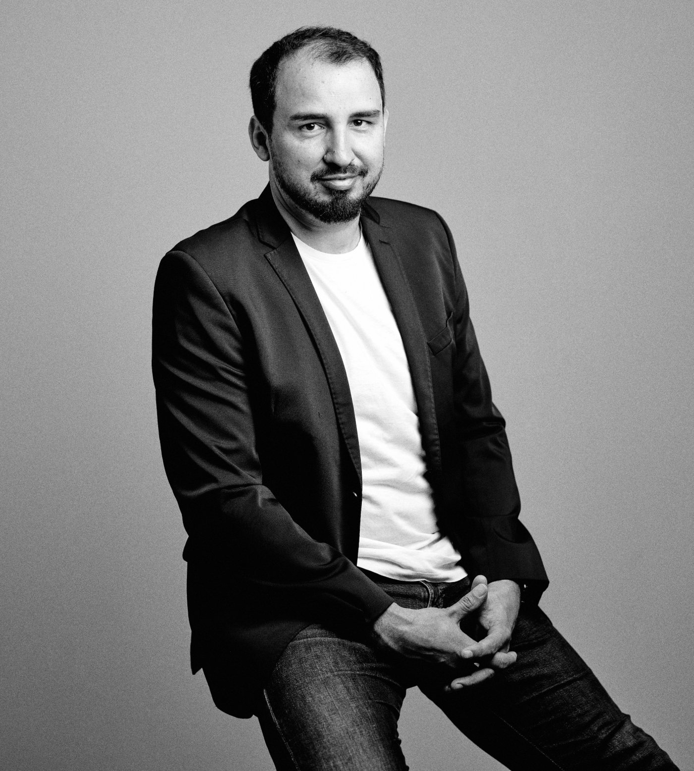 Peter Merc — black-and-white studio portrait